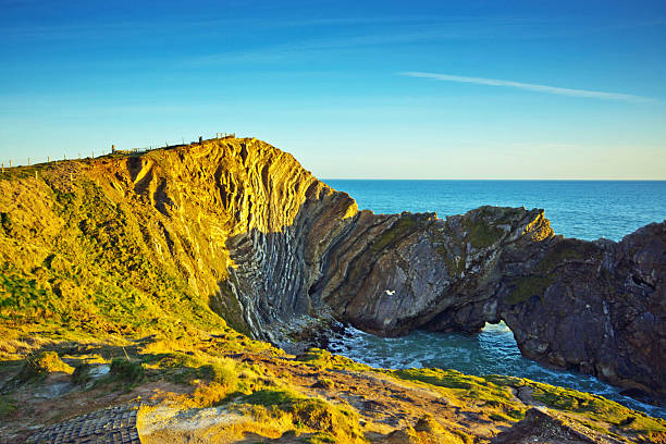 istock Lulworth Cove at sunset 487410782