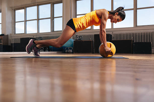 istock Female athlete working out on her core muscle 487411830