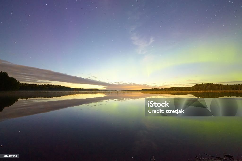 Northern Lights Reflections Northern lights with reflection on the lake at night. 2015 Stock Photo
