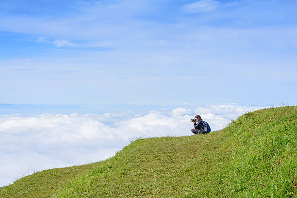 istock women photographer on the hill 487412166