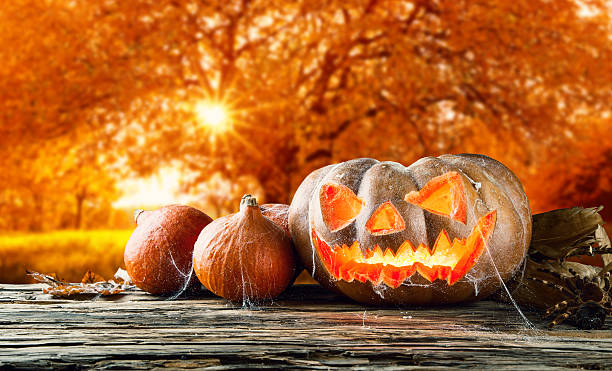 istock Halloween pumpkin on wooden planks 487412486