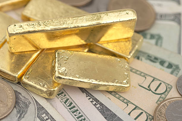 istock Gold bar on US dollar money 487414786