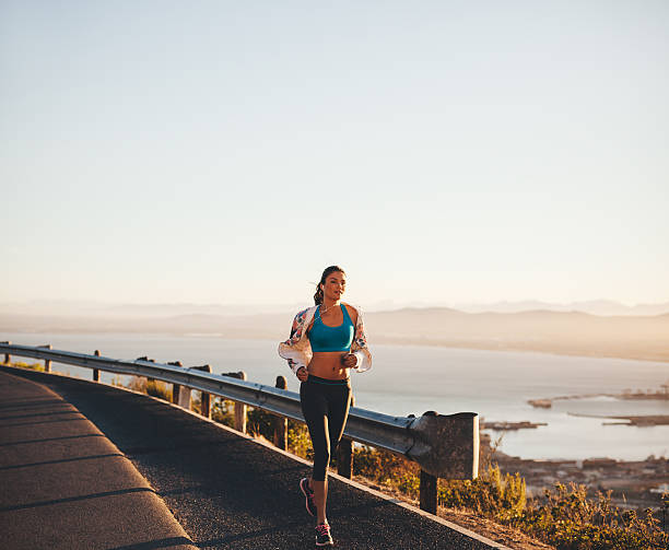 istock Young woman her morning run 487417036