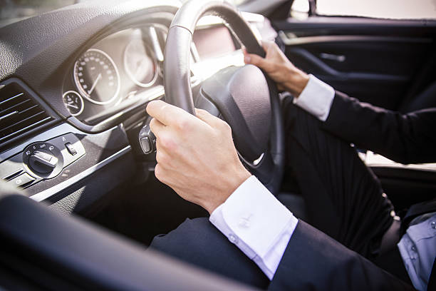 istock Male hands driving car 487417178