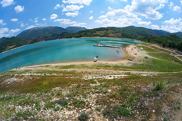 Panoramic view with fisheye effect of Lake Turano in Italy during the summer.
