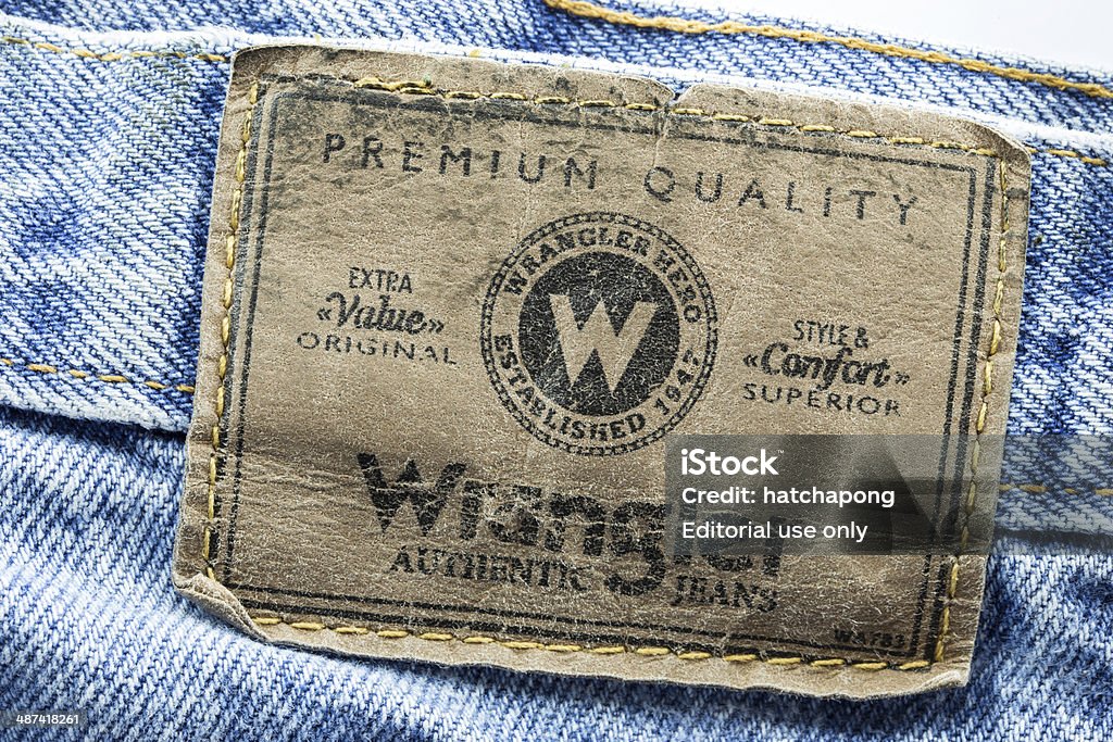 Closeup Of Wrangler Leather Label Sewed On A Blue Jeans Stock Photo -  Download Image Now - iStock