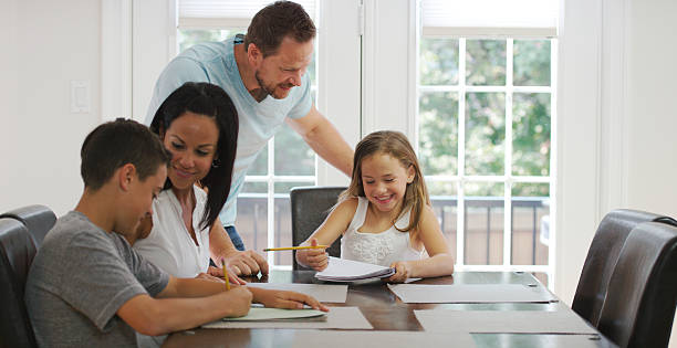 istock Family of Four at the Table 487418288