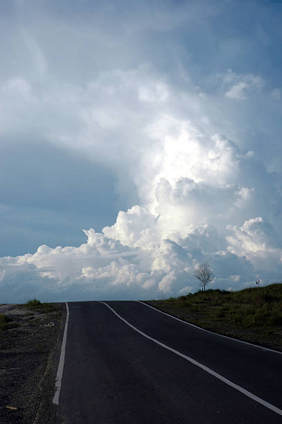 istock uphill road leading to the blue cloud 487418716
