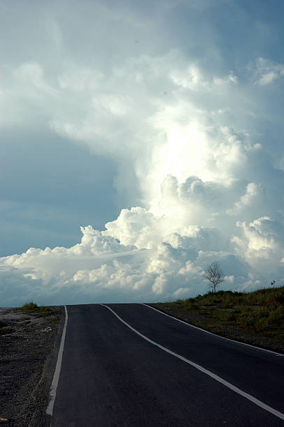 istock uphill road leading to the blue cloud 487419230