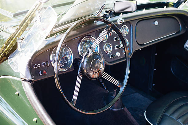 istock Vintage covertible car cockpit with stylish green paint 487419604