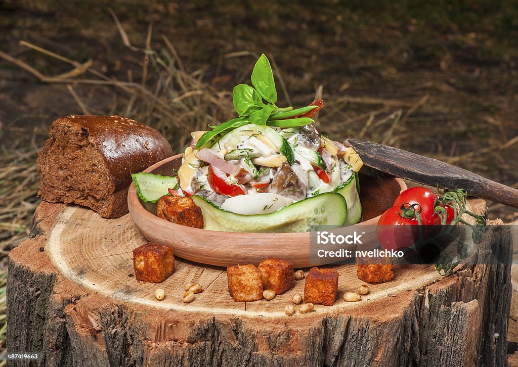 Salad under mayo dressing Salad with meat, tomatoes, cucumber and rusk under mayo dressing Awe Stock Photo