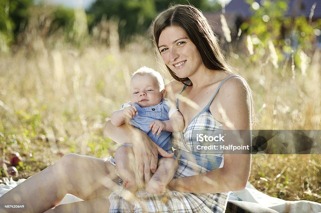 Mother and son Happy young mother having fun with her son in nature 30-39 Years Stock Photo