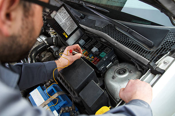 Car electric repair Car electric repair,  Repair of electrical wiring in the car. electrical fuse stock pictures, royalty-free photos & images