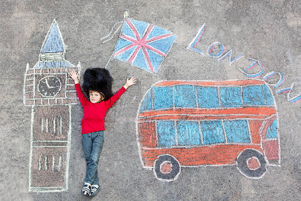 istock kid boy in british soldier uniform with London chalks picture 487423390