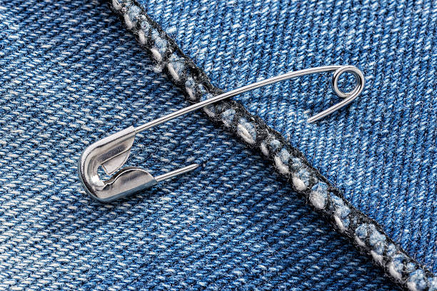 Safety Pin and Jeans stock photo