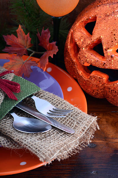 istock Happy Halloween table with Jack O Lantern pumpkin 487424462