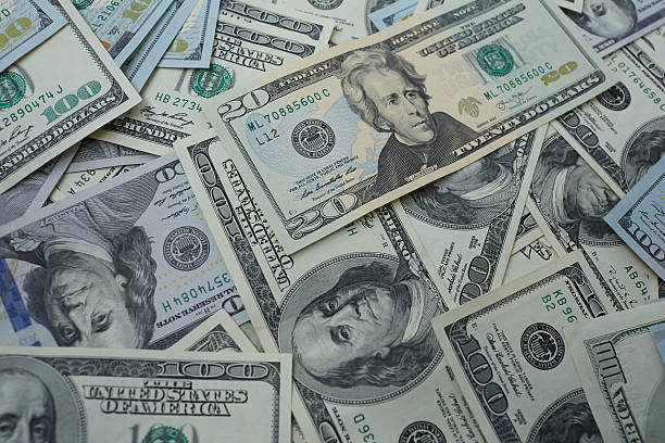 istock banknotes to twenty and one hundred USD 487424726