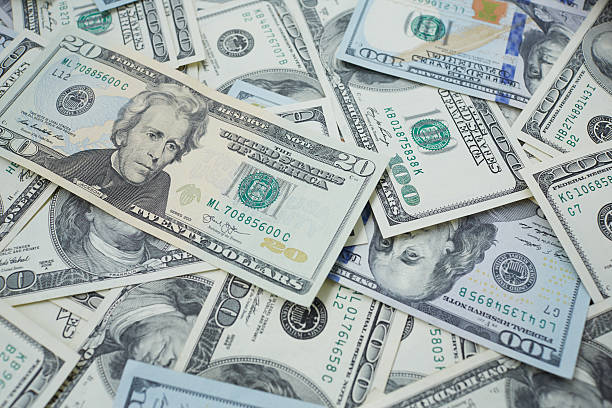 istock banknotes to twenty and one hundred USD 487424736