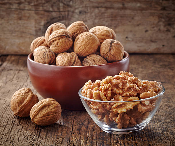 istock various kinds of walnuts on old wooden table 487424779
