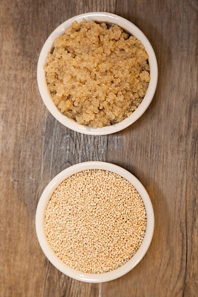 raw and cooked quinoa stock photo