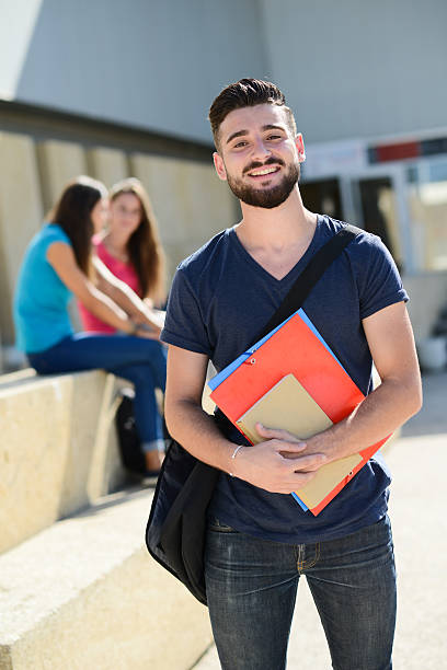 istock young student man with beard outdoor in high school campus 487426212