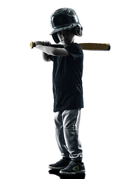 istock child playing softball players silhouette isolated 487426304