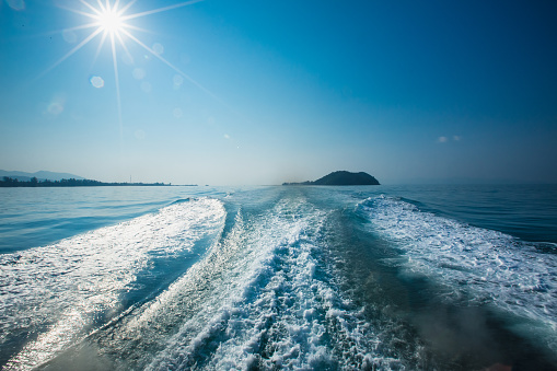 Wake of a ferry boat. Leaving  the one of island in Thailand