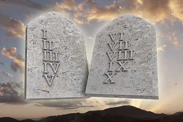 the ten Commandments on a sunset background