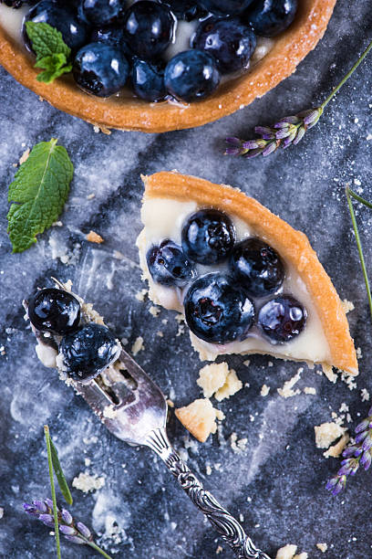 istock eating blueberry tart on marble board 487431442