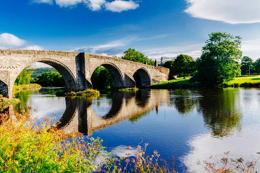 Stirling Bridge crossing the River Forth at Stirling in Scotland. The present stone bridge dates back to around 1500AD, about two centuries after the famous battle involving William Wallace on a wooden bridge further upstream.