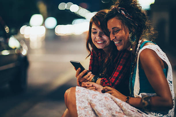 istock Two friends watching at the phone 487433562