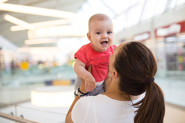 istock mother and baby smiling 487436886