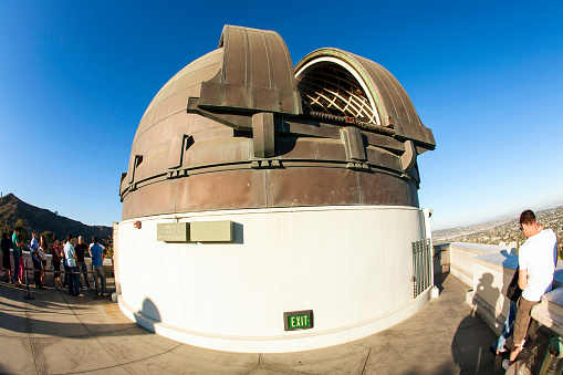 Los Angeles, USA - June 24, 2012: famous Griffith observatory is open to watch the  moon constellation in Los Angeles, USA. People  watch the moon with the famous  12-Inch Zeiss Refracting Telescope from 1931.
