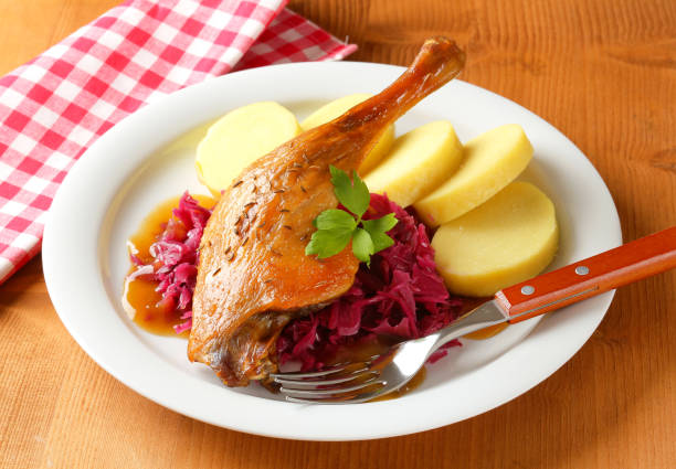 istock Roast duck with potato dumplings and red cabbage 487442553