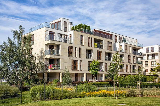 istock Green square in front of apartment buildings 487443234