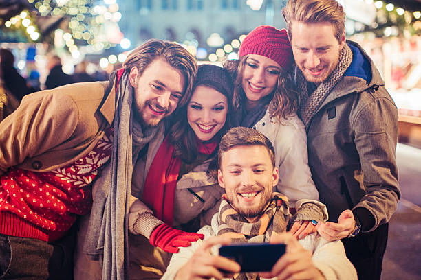 istock Friends having fun outdoors at winter holidays. 487445526