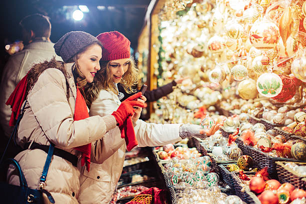 istock Friends shopping at christmas fair. 487445582