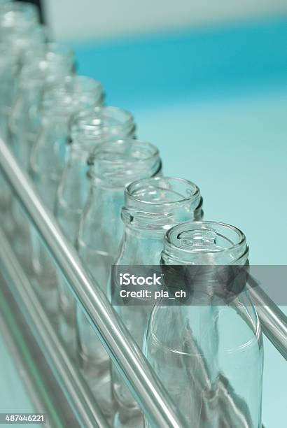 Glass Bottles On The Conveyor Belt Stock Photo - Download Image Now - Food Processing Plant, Equipment, Activity