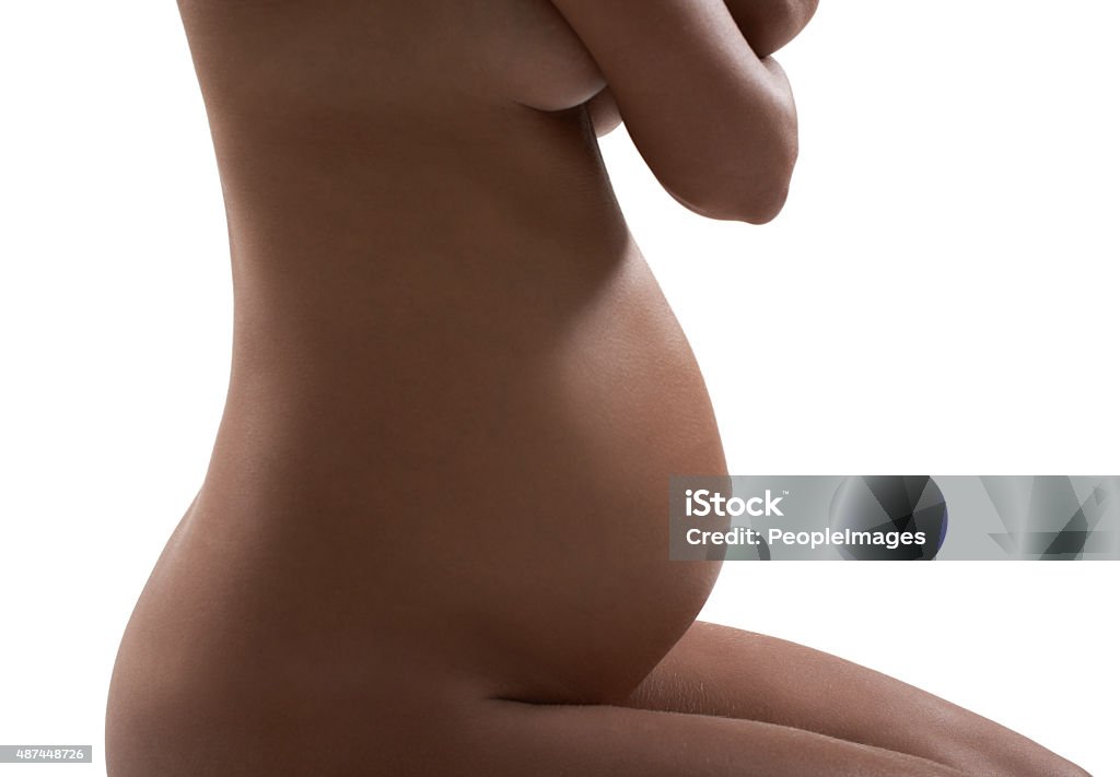 Glowing with motherhood Studio shot of a pregnant woman Naked Stock Photo