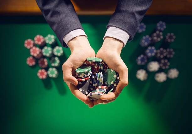 istock Casino playes holding a handful of chips 487449398