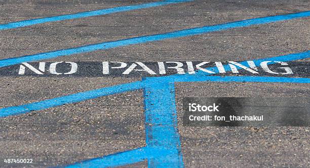 No Parking Painted Sign On The Road Stock Photo - Download Image Now - 2015, American Culture, Asphalt