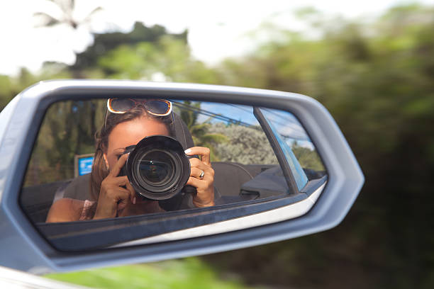istock Young female photographer with camera 487451236
