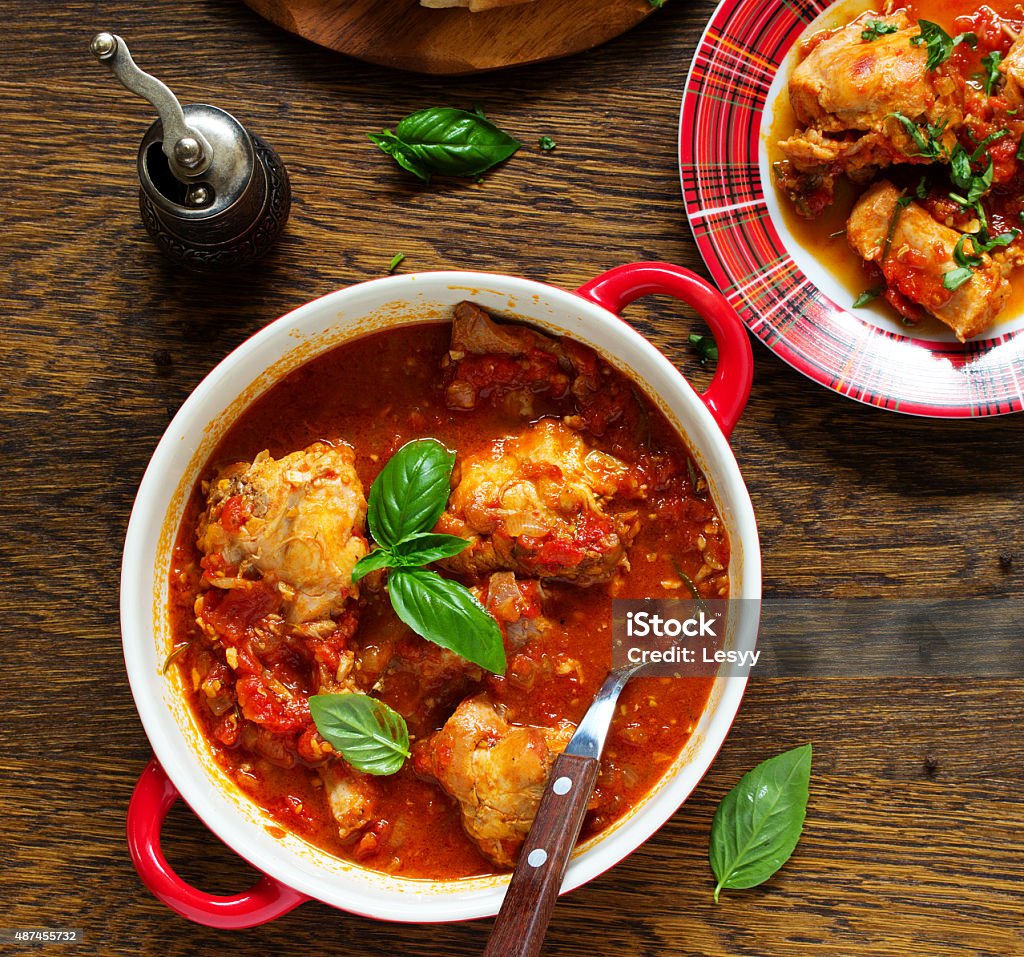 Baked rabbit in tomato sauce with rosemary and basil. Baked rabbit in tomato sauce with rosemary and basil. Italian Cuisine. 2015 Stock Photo