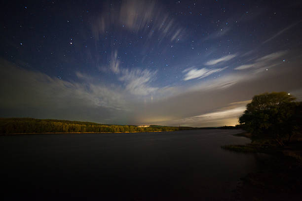 istock beautiful night landscape, moonrise, lake and trees 487458186