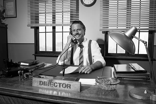 istock 1950s office: director working on the phone 487458350