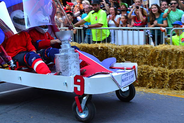Montreal Red Bull Soapboax Race Montreal, Canada - September 06, 2015: Montreal Red Bull Soapboax Race in Montreal Downtow.A lot of fun and ingenious ideas.Number 9-Quebec hokey team. red bull mini stock pictures, royalty-free photos & images