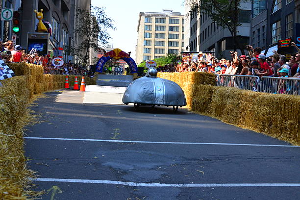 Montreal Red Bull Soapboax Race Montreal, Canada - September 06, 2015: Montreal Red Bull Soapboax Race in Montreal Downtow.A lot of fun and ingenious ideas.Number 10-Aerodynamic  team. red bull mini stock pictures, royalty-free photos & images