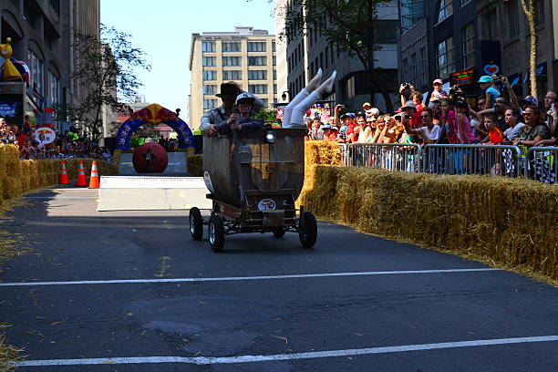 Montreal Red Bull Soapboax Race Montreal, Canada - September 06, 2015: Montreal Red Bull Soapboax Race in Montreal Downtow.A lot of fun and ingenious ideas.Number 12-Indiana Jones team. red bull mini stock pictures, royalty-free photos & images