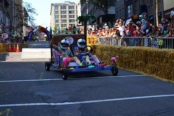 Montreal Red Bull Soapboax Race Montreal, Canada - September 06, 2015: Montreal Red Bull Soapboax Race in Montreal Downtow.A lot of fun and ingenious ideas.Number 13-Caribbean ressort team. red bull mini stock pictures, royalty-free photos & images