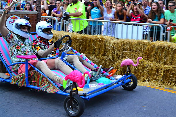 Montreal Red Bull Soapboax Race Montreal, Canada - September 06, 2015: Montreal Red Bull Soapboax Race in Montreal Downtow.A lot of fun and ingenious ideas.Number 13-Caribbean ressort team. red bull mini stock pictures, royalty-free photos & images